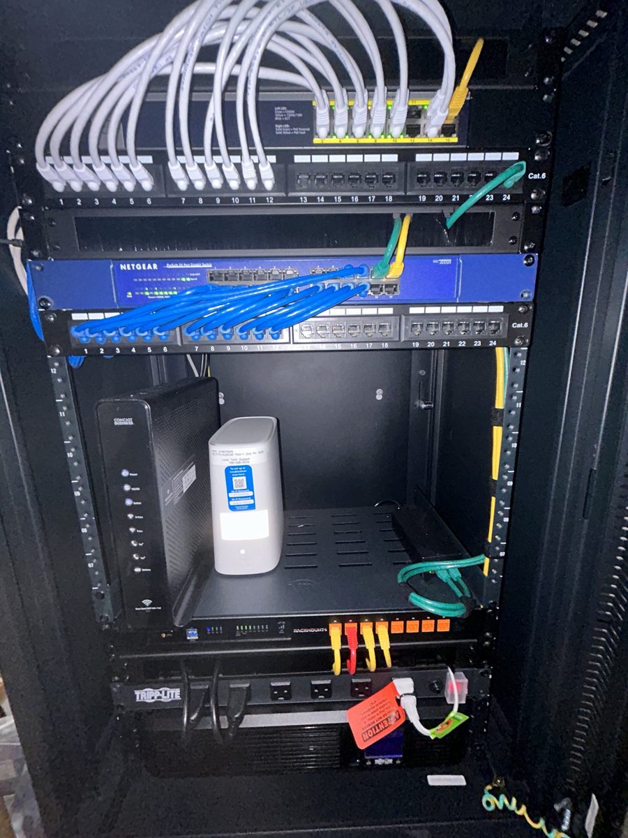 Wall-mounted network cabinet, labeled and routed