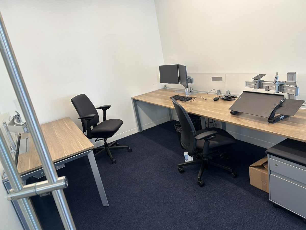 Client desk setup by the window